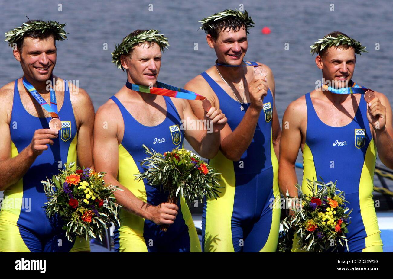 Ukraine's bronze medal rowers Sergij Grin, Sergij Bilushchenko, Oleg Lykov  and Leonid Shaposhnikov show their medals during the awards ceremony after  the men's quadruple sculls final at the Athens 2004 Olympic Summer