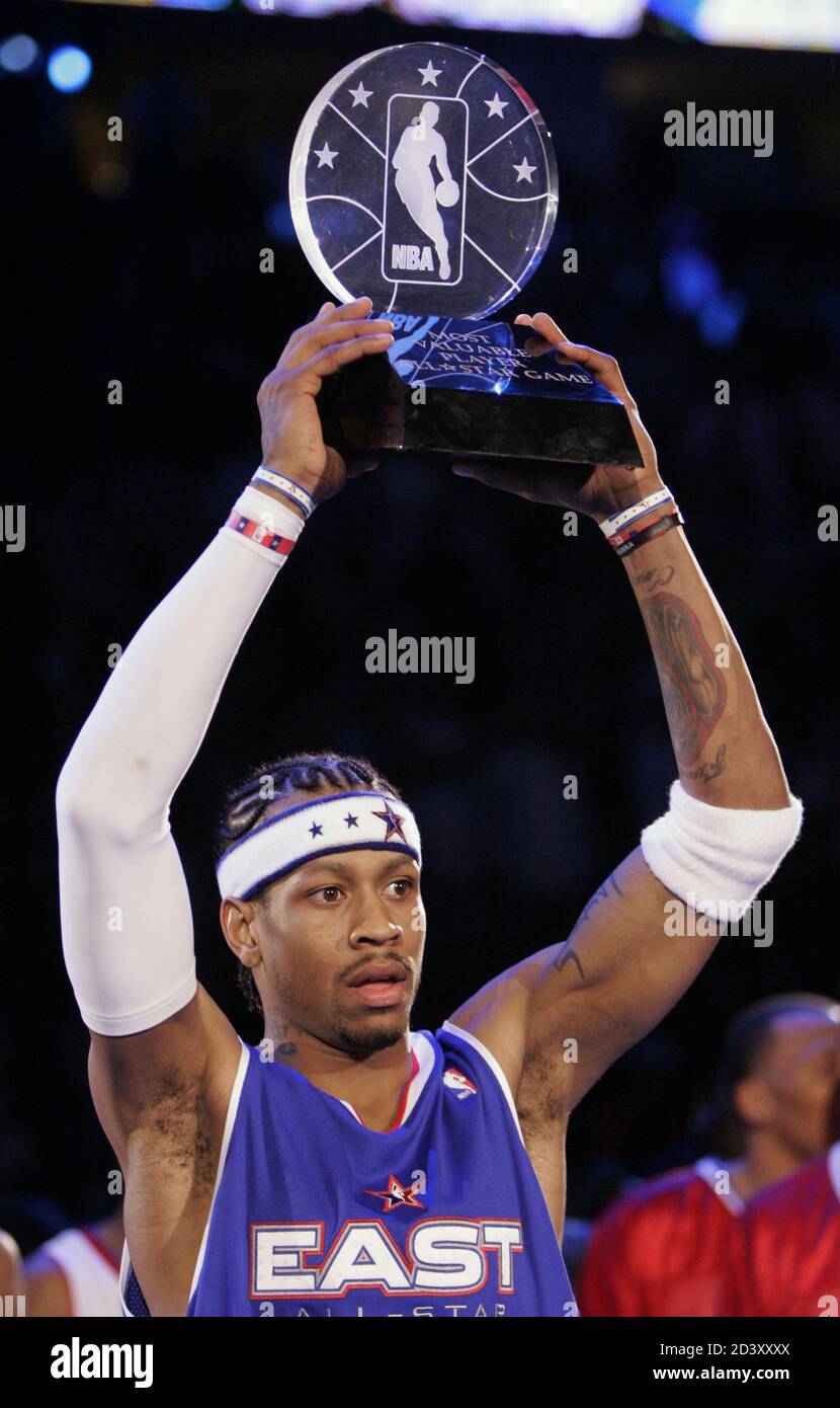 Philadelphia 76ers guard Allen Iverson holds up his Most Valuable Player  trophy after the 54th NBA All-Star Game in Denver, February 20, 2005.  Iverson scored 15 points to go with ten assists
