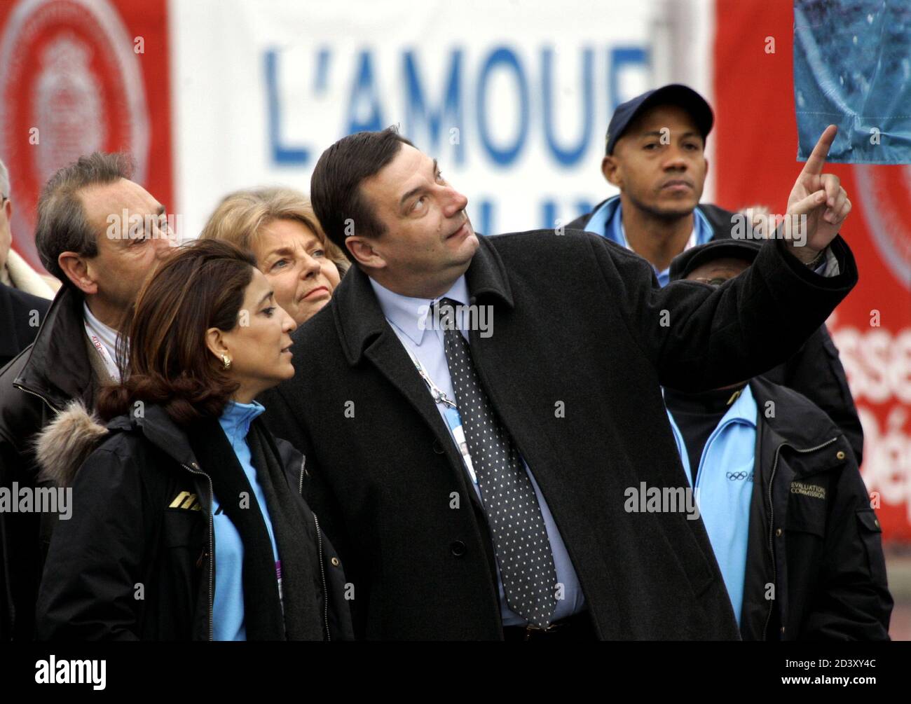 International Olympic Committee Evaluation Commission chairwoman Nawal El Moutawakel of Morocco (L) listens to French Sports Minister Jean-Francois Lamour (R) during a visit to the Batignolles area in Paris, March 10, 2005. The evaluation Committee is on a four-day visit to examine Paris' bid for the 2012 Games. Stock Photo