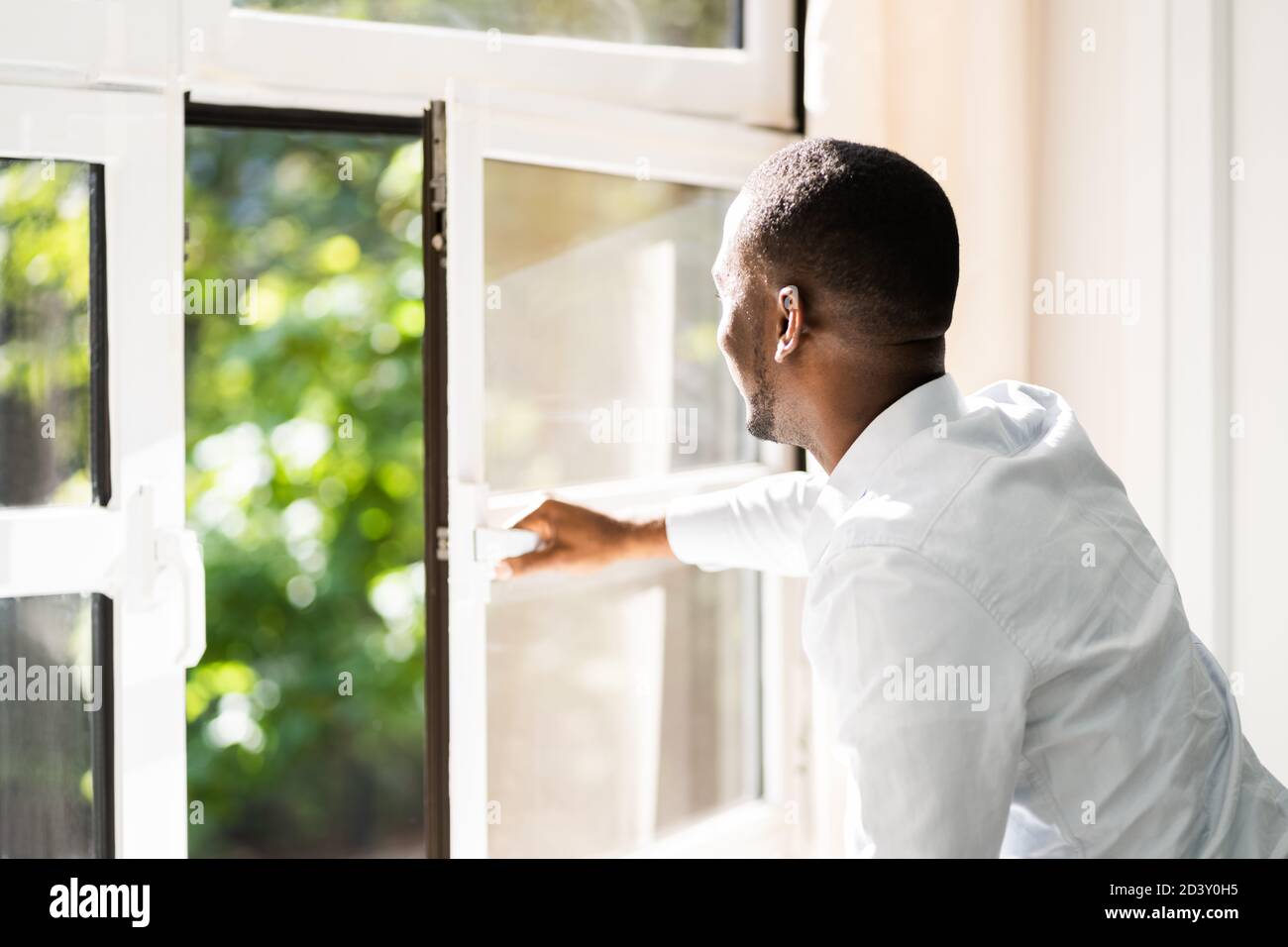 Fresh Air From Window. Side View Of Man Relaxing Stock Photo