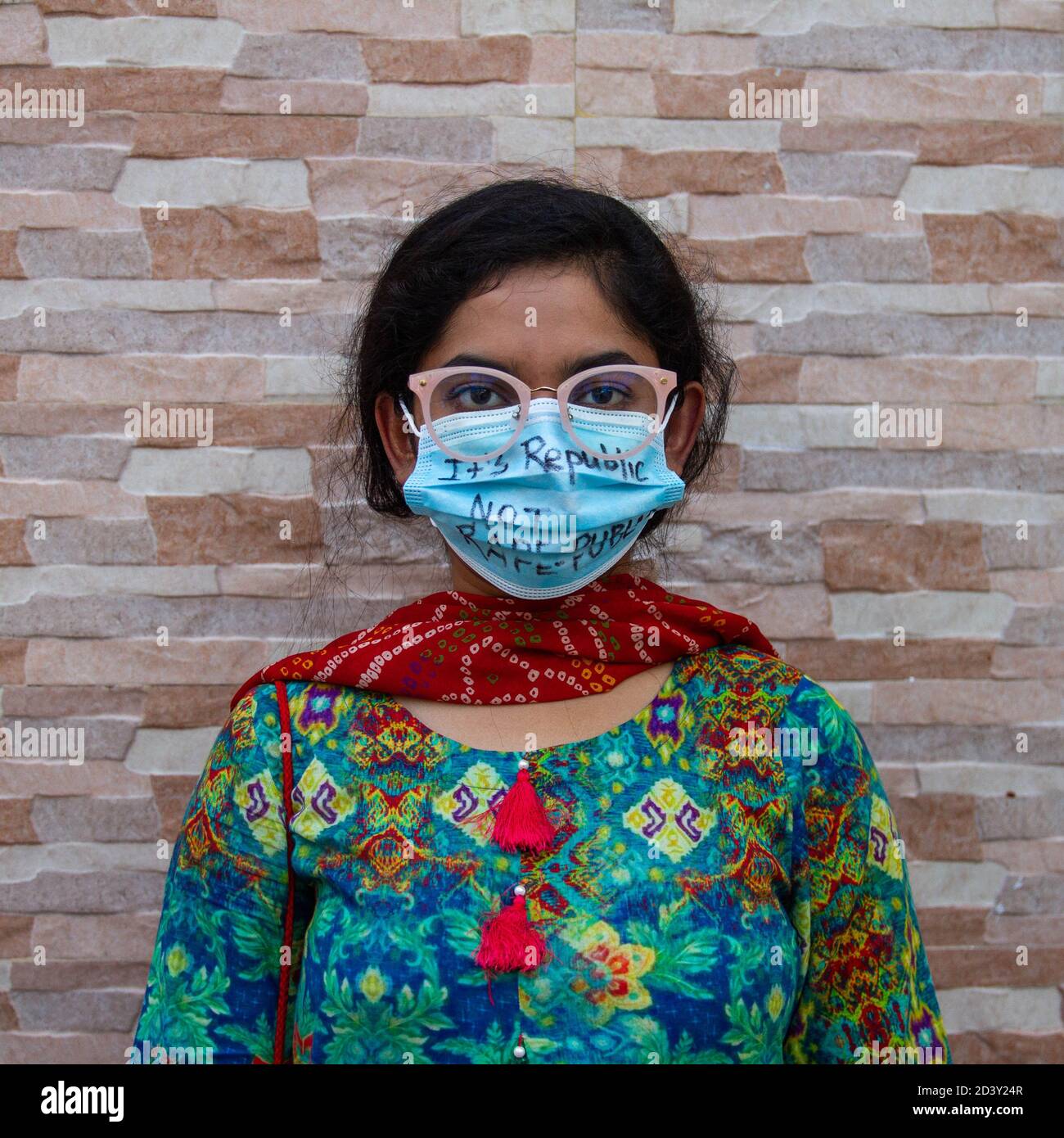 Dhaka, Bangladesh. 8th Oct, 2020. Protestors wearing facemasks with their  protest narratives smeared in it came out in the street during the COVID-19  pandemic to voice out their solidarity for justice towards