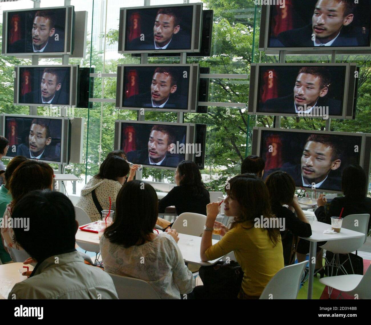 Japanese Soccer Fans Watch A Video Showing Japan S Midfielder Hidetoshi Nakata At The Nakata Net Cafe Run By Nakata In Tokyo May 30 02 The Cafe Offers Information For Soccer Fans From Throughout