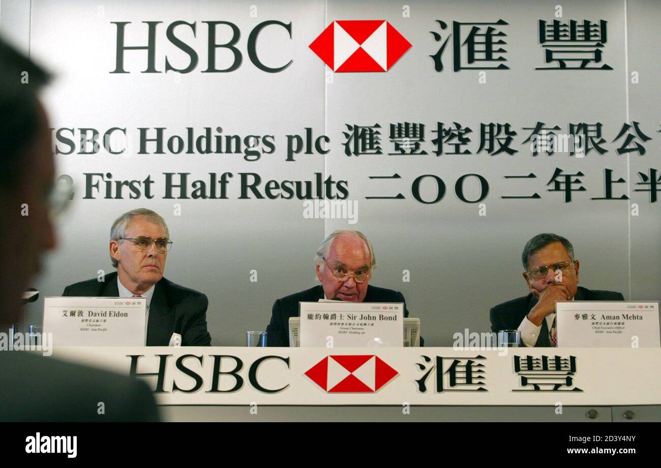 (From L-R) Chairman of HSBC Holdings Plc, David Eldon, Group Chairman of HSBC Holdings Plc, John Bond and Chief Executive Officer HSBC Asia Pacific, Aman Mehta attend the company's press conference announcing the 2002 interim results in Hong Kong August 5, 2002. HSBC Corp said on Monday its net profit fell 10 percent in the first half of 2002 as mounting personal bankruptcies and credit defaults more than doubled its bad debt charges. Stock Photo