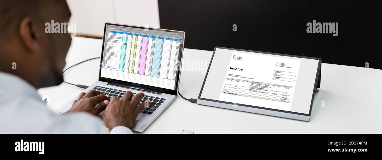 Analyze Spreadsheet Data On Laptop At Work Stock Photo