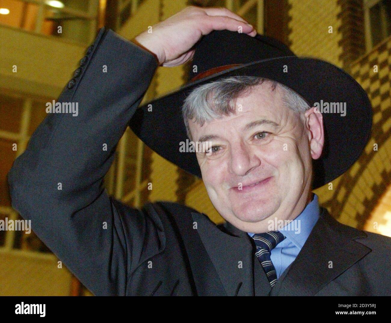 German Foreign Minister Joschka Fischer puts on a traditional Australian hat during the opening