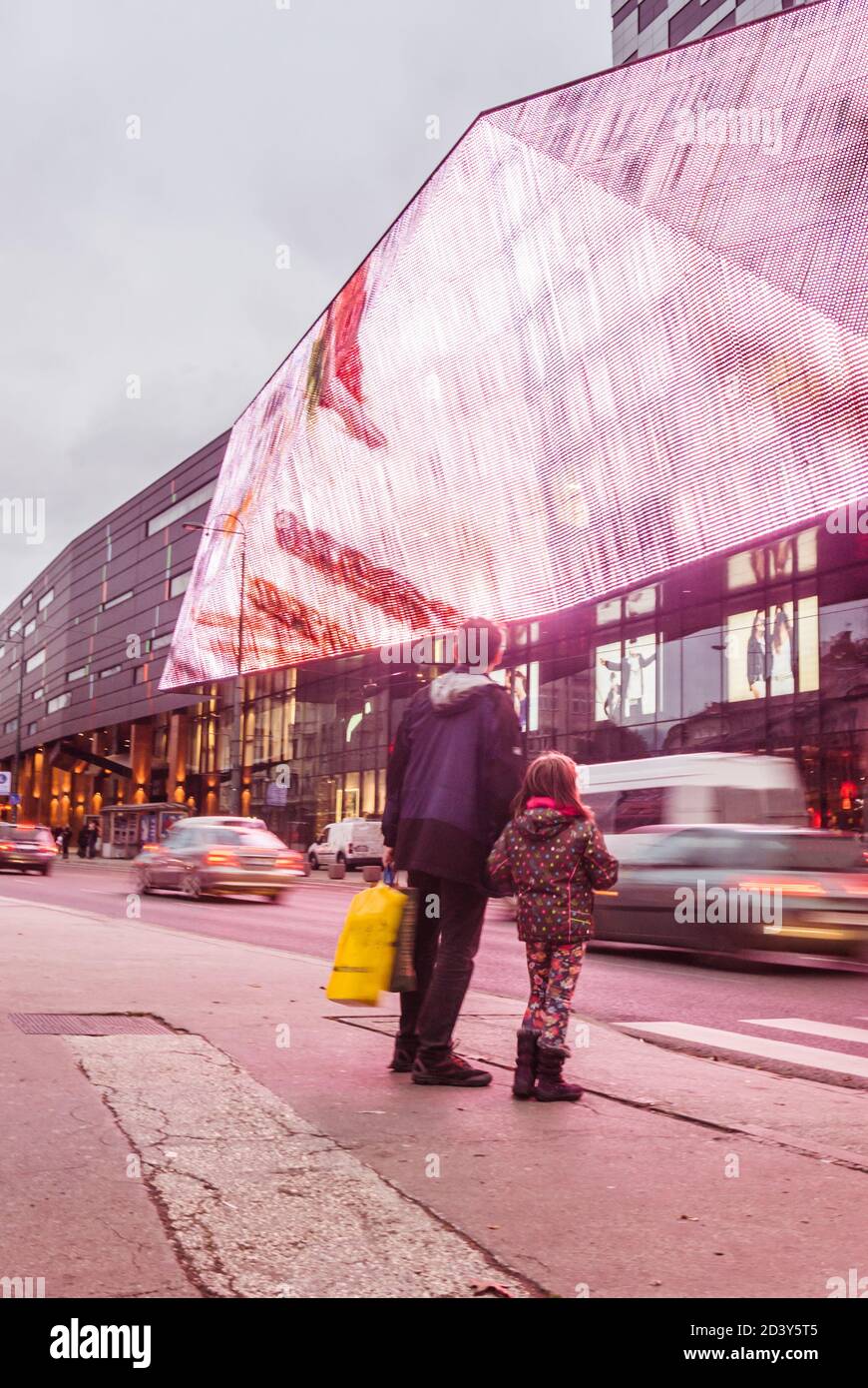 People and card speed moving forward in the city center traffic rush