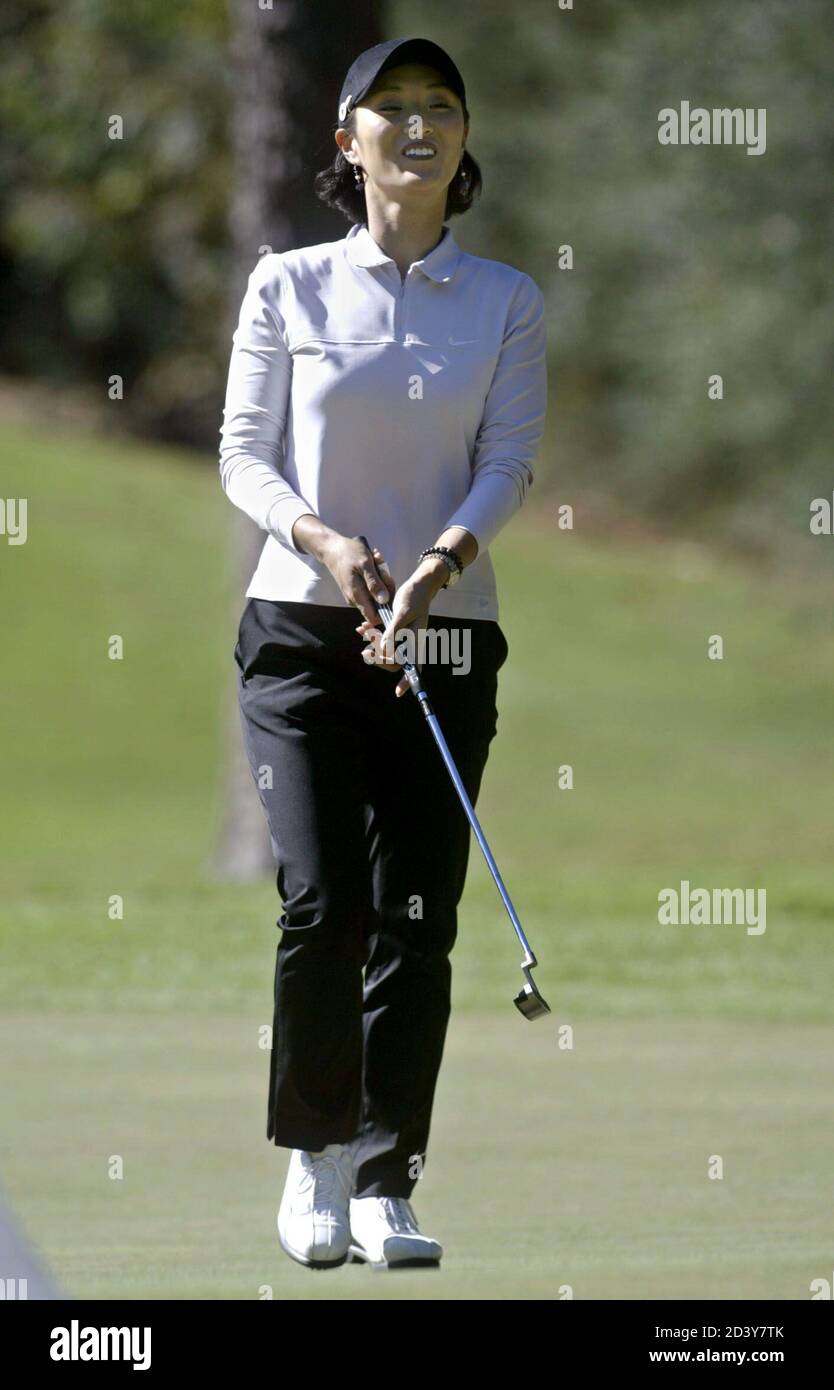 Grace Park Of Seoul South Korea Smiles As She Stretches To See Her Putt On The Sixth Green November 14 2003 During Play At The Lpga Tournament Of Champions At The Robert