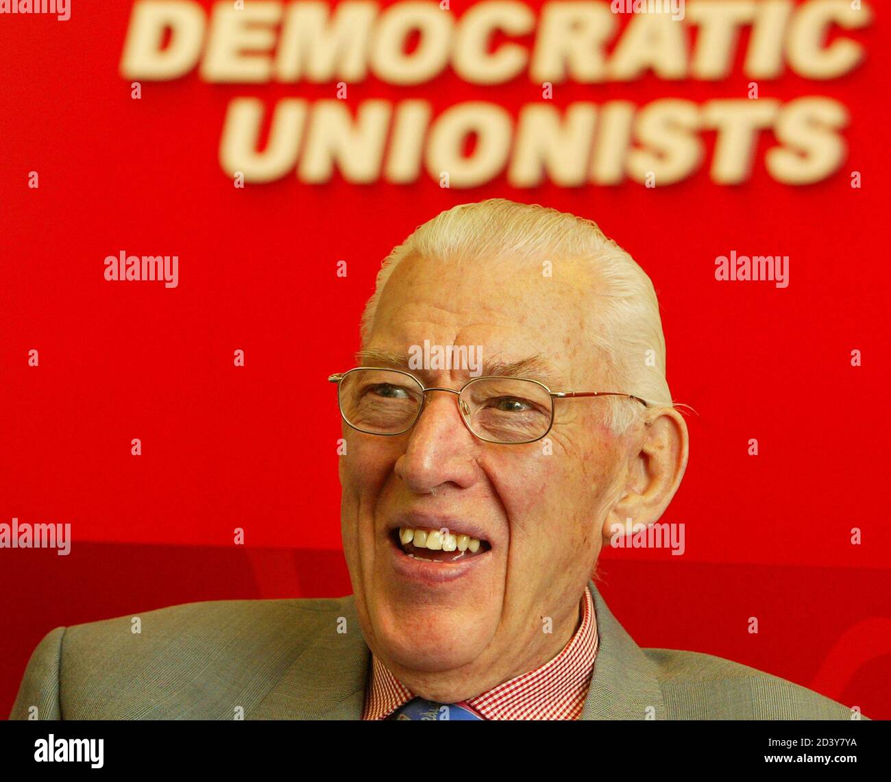 Democratic Unionist Party (DUP) leader Dr Ian Paisley smiles as he talks to the media at DUP headquarters in Belfast during elections to the Northern Ireland powersharing assembly, November 28, 2003. Britain's worst case scenario in Northern Ireland's election loomed on Friday as hardline Protestants opposed to a 1998 peace pact and their arch-foes, Catholics allied to the IRA, led the count. REUTERS/Peter Macdiarmid  PKM/ASA/THI Stock Photo