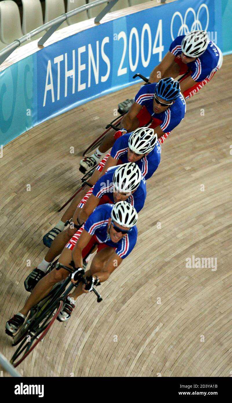 France's pursuit team rides during a training session in the Olympic velodrome at the Athens 2004 Olympic Summer Games August 19, 2004. The track cycling events get underway August 20. Stock Photo