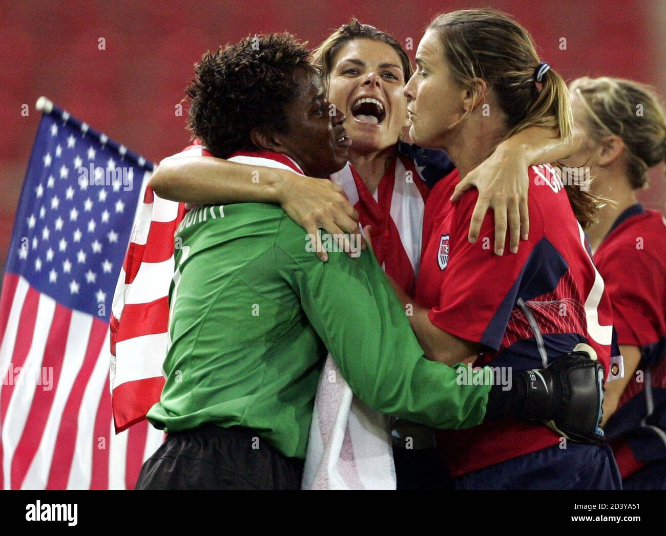 U.S. women#s soccer players Briana Scurry (L), Mia Hamm and Brandi Chastain  celebrate after beating Brazil in the gold medal match at the Athens 2004  Olympic Games August 26, 2004.The U.S won