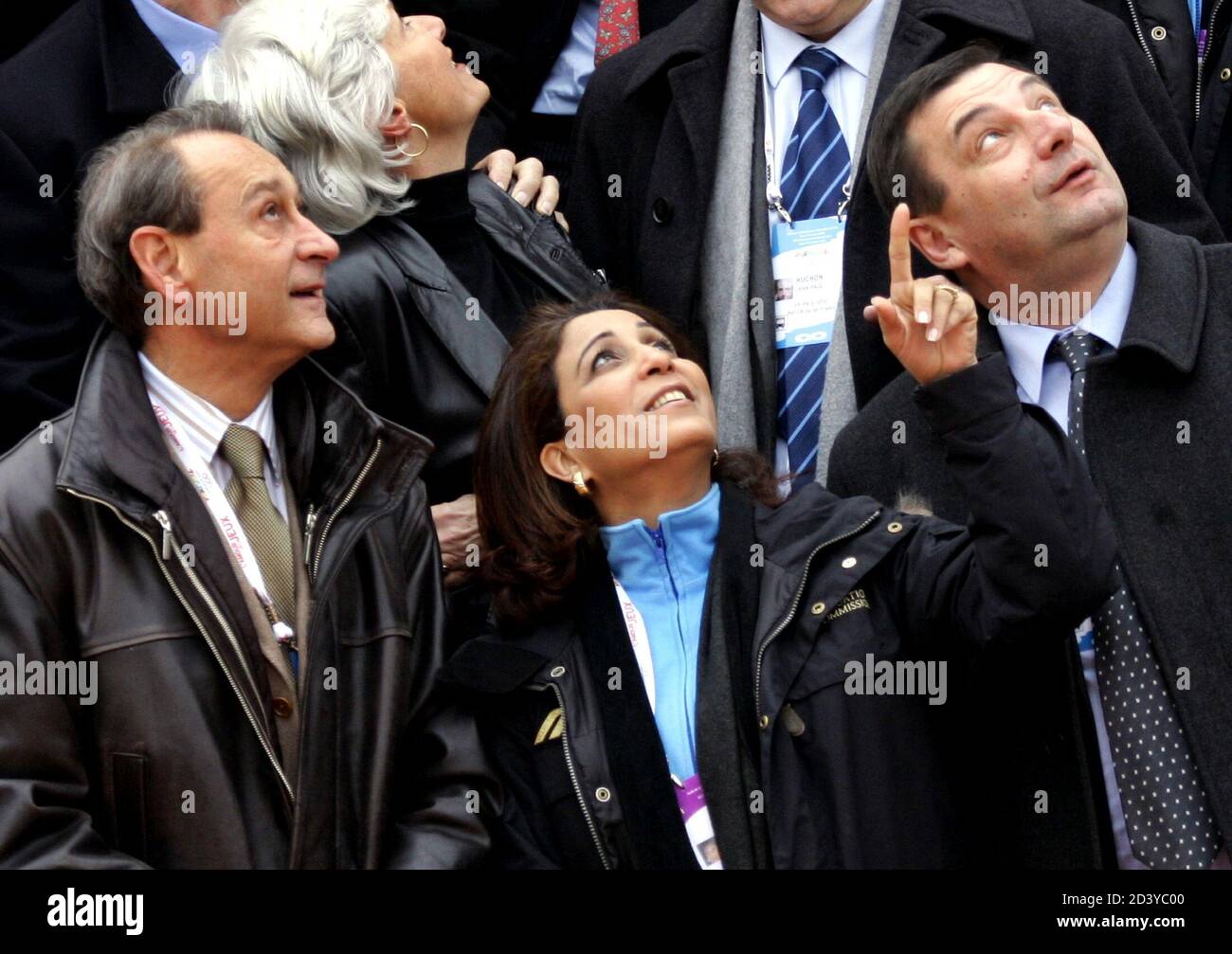 International OLympic Committee Evaluation Commission chairwoman Nawal El Moutawakel of Morocco (C) gestures next to Paris mayor Bertrand Delanoe (L) and French Sports Minister Jean-Francois Lamour (R) during a visit to the Batignolles area in Paris, March 10, 2005. The evaluation Committee is on a four-day visit to examine Paris'bid for the 2012 Games. Stock Photo