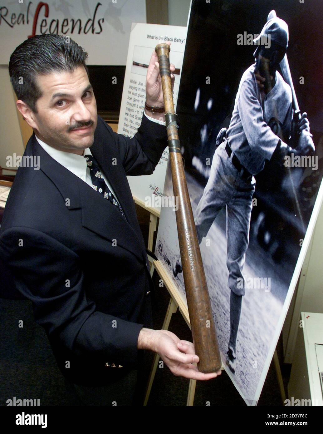 Black Betsy", the bat used "Shoeless" Joe Jackson during his 13-year year  major league baseball career, is displayed by Mike Nola at a press preview  in New York on July 24, 2001. "