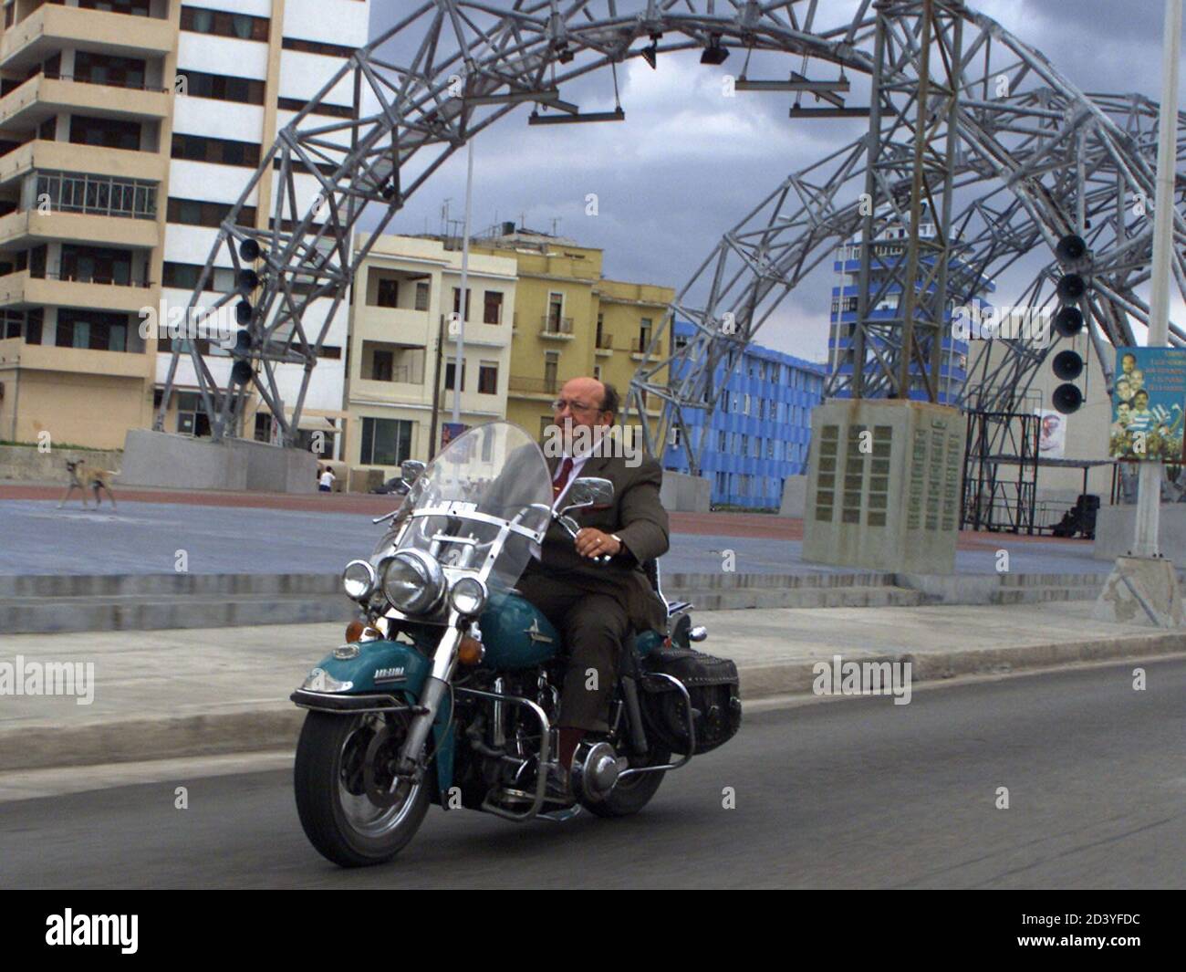 Taking a short break from his dry official agenda in Cuba, EU envoy and  Belgian Foreign Minister Louis Michel rides August 23, 2001 on a Harley  Davidson through Havana. His motorbike tour