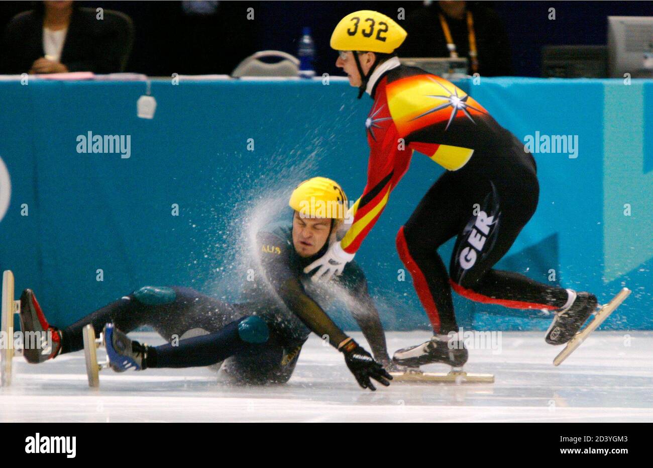Australian Steve Bradbury (L) slides on the ice after falling in front of  Germany's Andre Hartwig during a 1500 m short track heat at the Salt Lake  2002 Olympic Winter Games, February