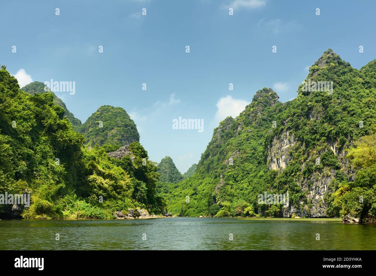 Vietnamese jungle, karst mountains and the Ngo Dong river in Trang An Landscape Complex, Ninh Binh, Vietnam Stock Photo