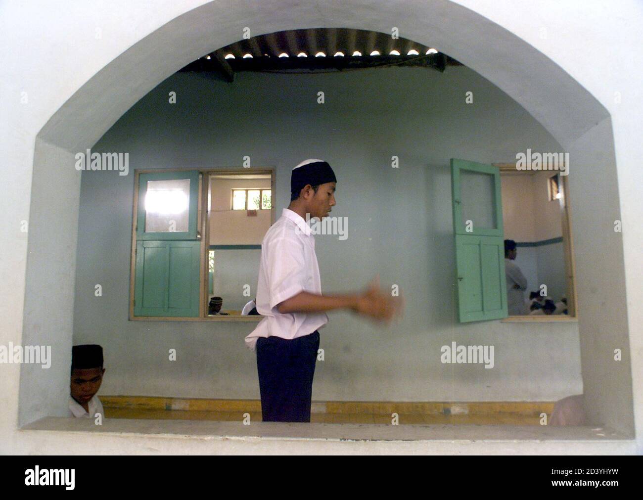 An Indonesian Muslim Student Prays At The Mosque Owned By Al Mukmin Boarding School Founded By Indonesian Muslim Cleric Abu Bakar Bashir In Solo Central Java October 29 2002 Indonesian Police Removed<script async src=