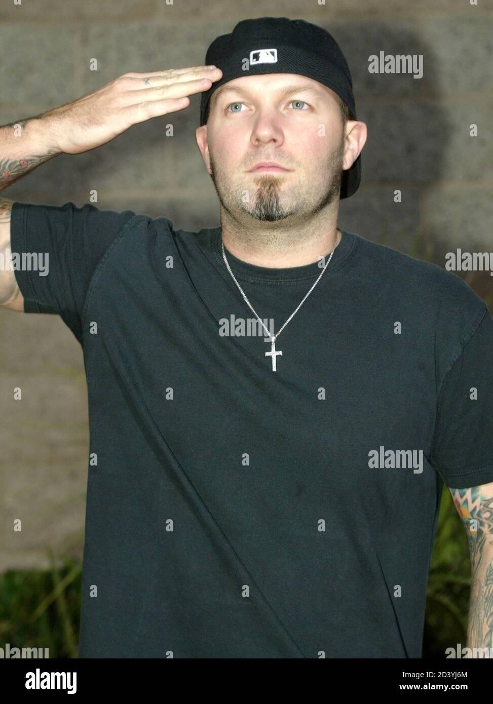 Fred Durst, singer of the rock group Limp Bizkit, strikes a pose as he makes his way down an arrival line at the 2002 Billboard Music Awards show at the MGM Grand Garden Arena in Las Vegas, Nevada, December 9, 2002. [Durst helped introduce a performance of the band Puddle of Mudd during the show. ] Stock Photo