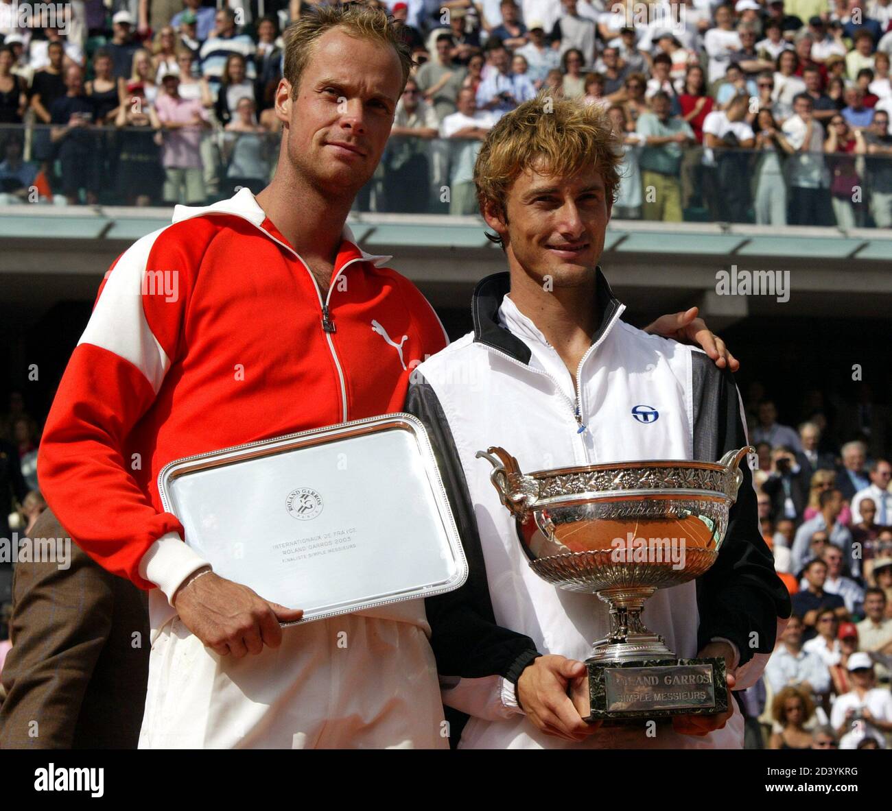Juan Carlos Ferrero Of Spain R And Martin Verkerk Of The Netherlands Pose With Their Trophies After Their Final Of The French Open Tennis Tournament At Roland Garros Stadium In Paris June