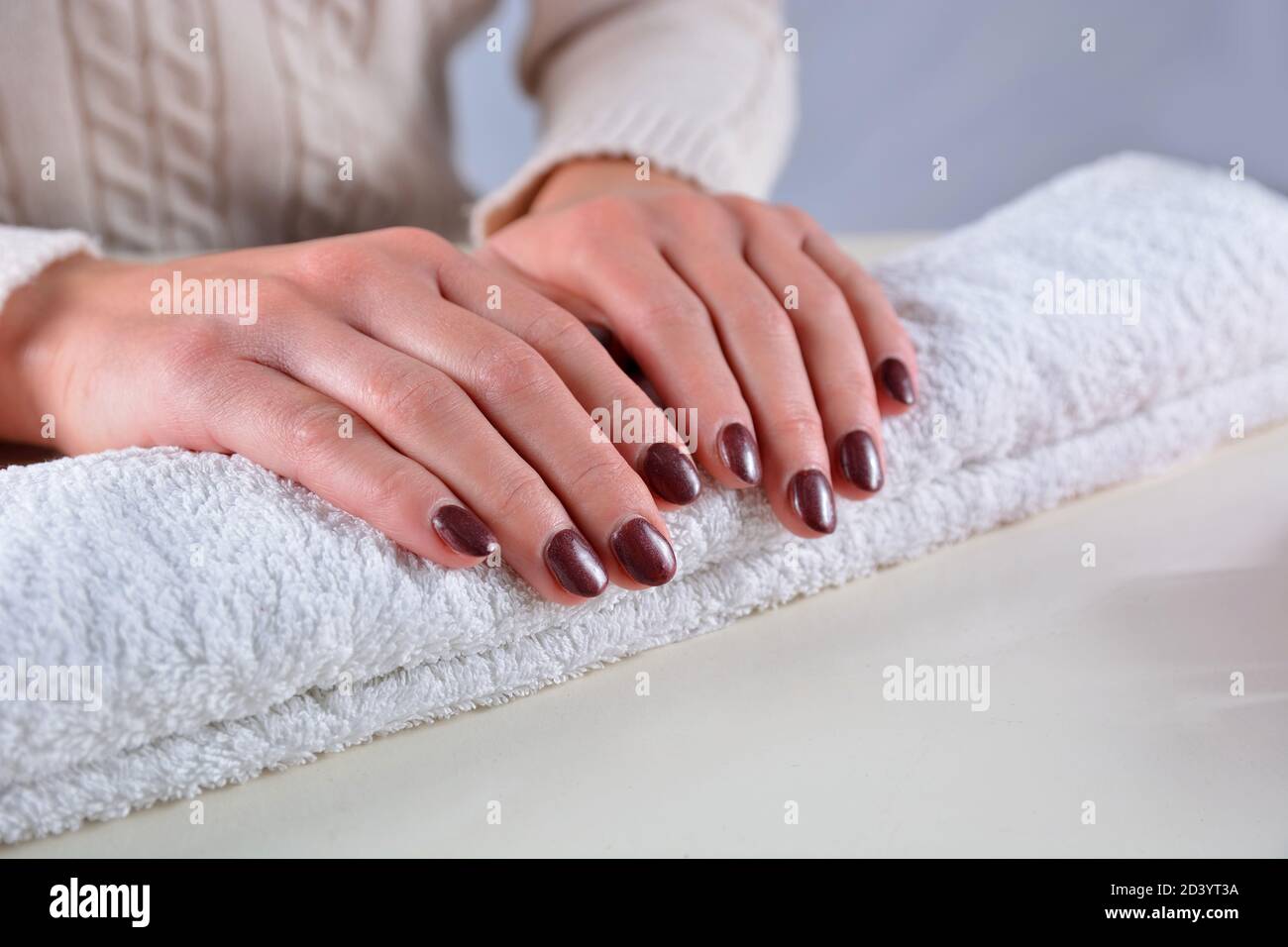 Hands with brown manicure Stock Photo by ©belchonock 124778972