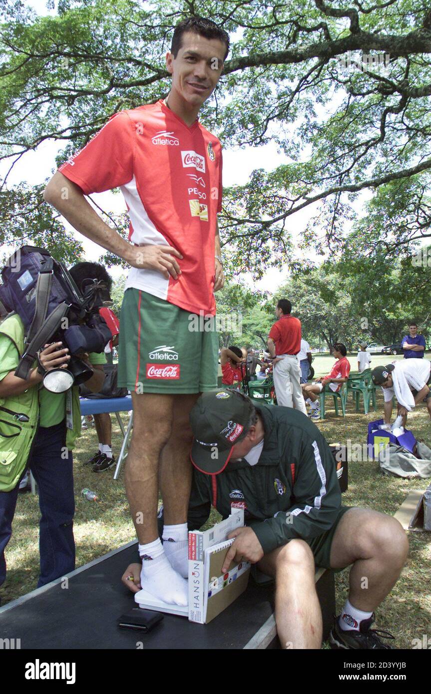 Mexico's Jared Borgueti is weighed by team doctor, Radames Gaxiola, at the Campestre Club in Cali where the team is staying during the Copa America, July 13, 2001. Mexico upset Brazil in their first match of the tournament and plays Paraguay on July 15.  RR Stock Photo