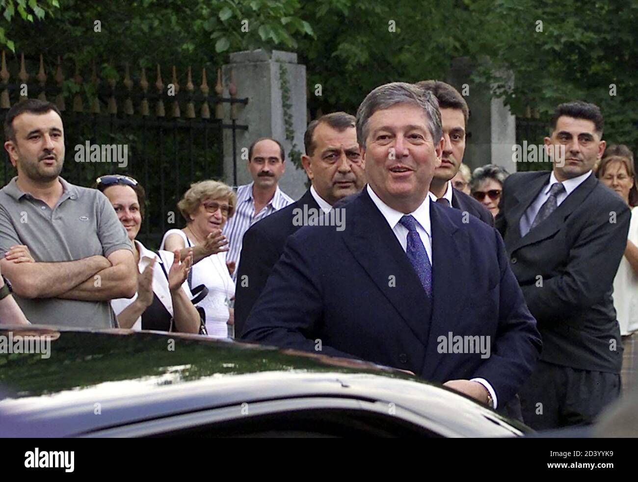 Yugoslav Crown Prince Alexander Karadjordjevic (C) smiles as he arrives