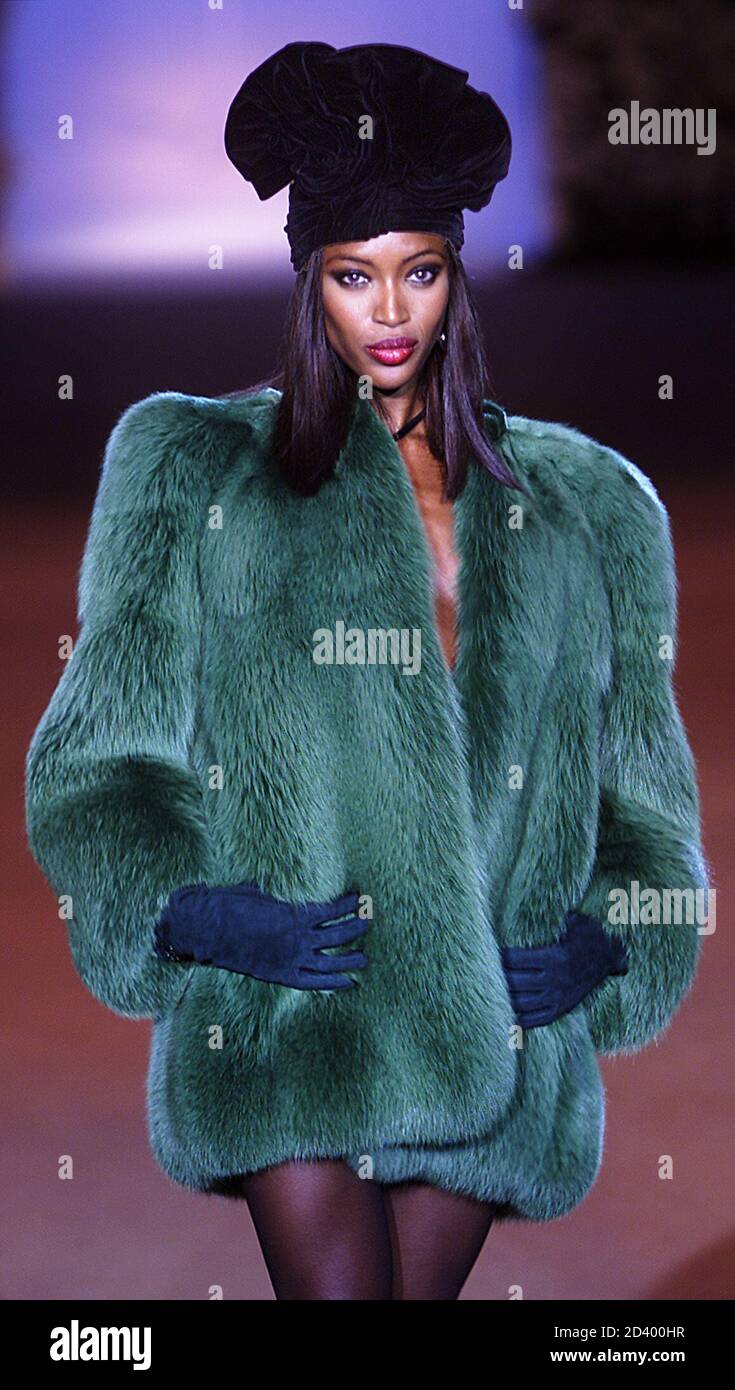 British top-model Naomi Campbell presents this green coat for veteran  French designer Yves Saint Laurent at his retrospective haute couture  fashion show at the Pompidou Centre in Paris, January 22, 2002. At