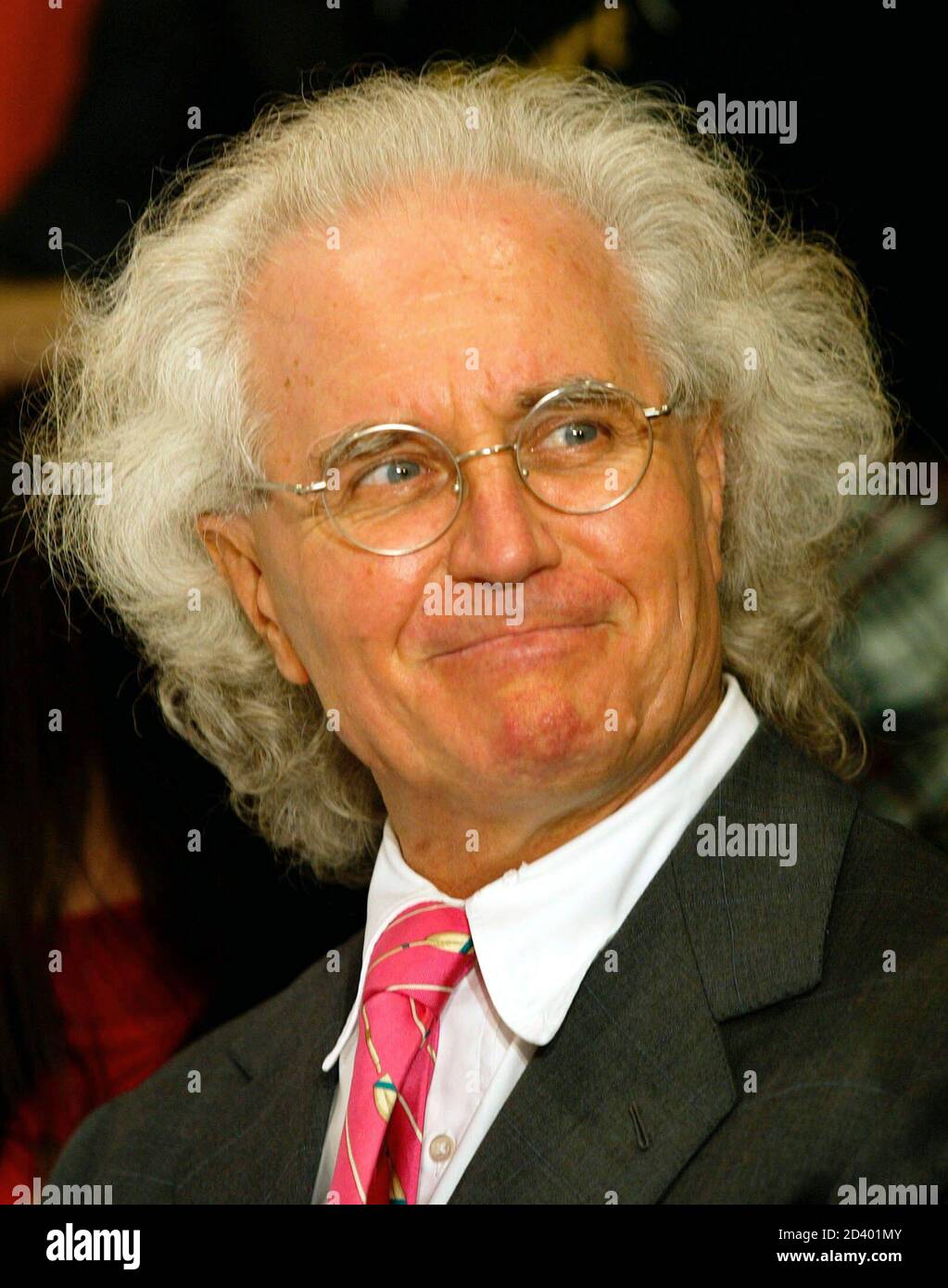 Luciano Benetton reacts during a fashion show at the newly opened luxury  shop of the Italy's largest clothing retailer Benetton in Sofia on  September 13, 2002 Stock Photo - Alamy