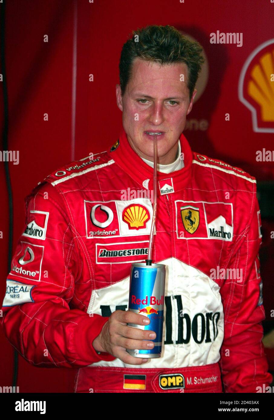 Michael Schumacher of Germany drinks in the Ferrari pit during the free  practice session for the upcoming Formula One Grand Prix of Monaco in  Monaco May 29, 2003. The Monaco Grand Prix