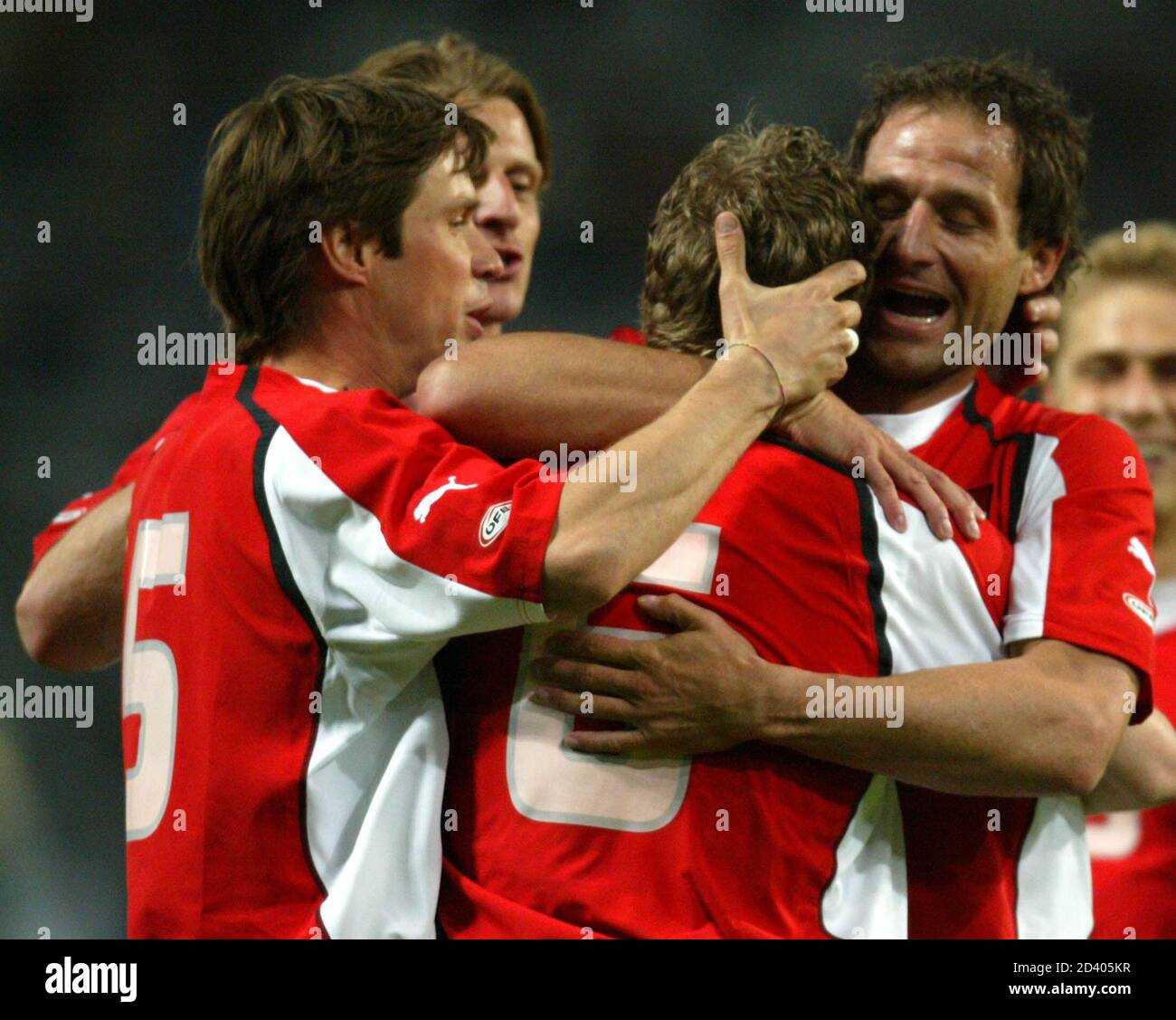 AUSTRIA'S CERNY,KIESENEBNER AND KIRCHLER CELEBRATE DURING THEIR FRIENDLY SOCCER MATCH AGAINST LUXEMBOURG IN INNSBRUCK.  Austria's Harald Cerny, Markus Kiesenebner and Roland Kirchler (L-R) celebrate during their friendly soccer match against Luxembourg in Innsbruck, Austria, April 28, 2004. REUTERS/Miro Kuzmanovic REUTERS Stock Photo