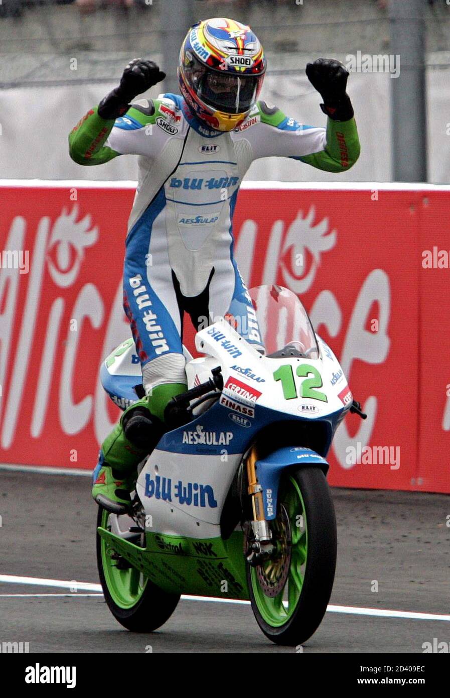 Honda 125cc rider Thomas Luthi of Switzerland celebrates victory in the  French Grand Prix at the Le Mans circuit in central France. Honda 125cc  rider Thomas Luthi of Switzerland celebrates victory in