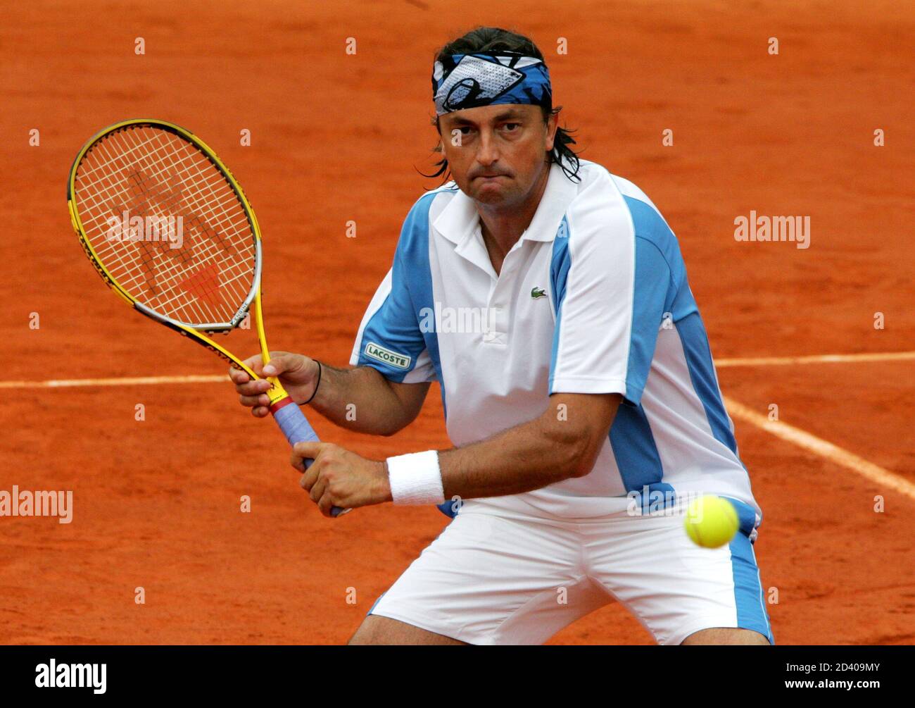 French former tennis star Leconte hits a forehand to Australia's Cash and  France's Champion during their veteran's double match at Roland Garros  stadium in Paris. French former tennis star Henri Leconte hits