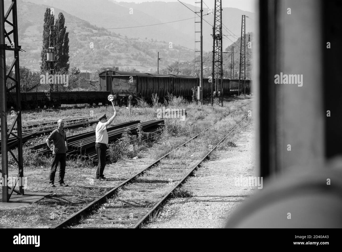 Dispatcher at the train station giving signal to the train Stock Photo