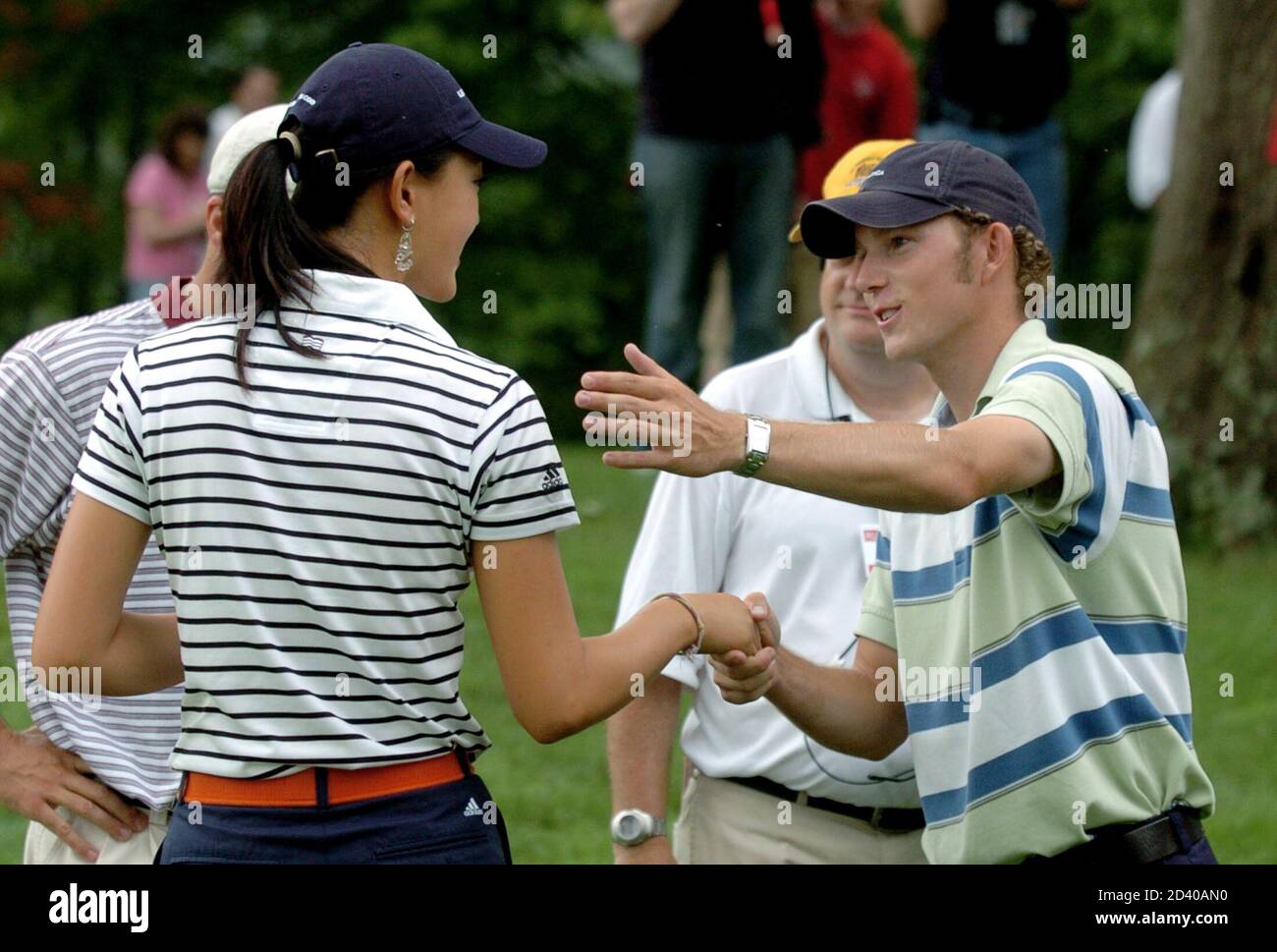 Michelle Wie shakes hands with Clay Ogden after Ogden defeated her in their quarter-final round in Lebanon, Ohio.  Michelle Wie (L) of the U.S. shakes hands with compatriot Clay Ogden (R) after Ogden defeated her 5 and 4 in their quarter-final round of match play in the 2005 United States Amateur Public Links Championship at Shaker Run Golf Club in Lebanon, Ohio, July 15, 2005. REUTERS/John Sommers II Stock Photo