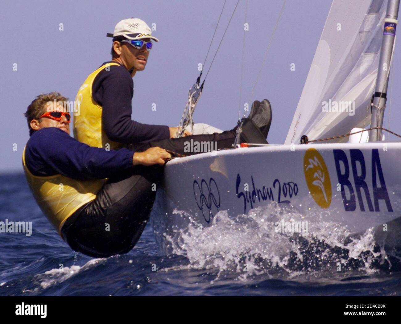 Olympic yachtsmen Torben Grael (rear) and Marcelo Ferreira (front) of  Brazil sail their Star class yacht before the start of the final race off  Sydney, September 30, 2000. The gold was won