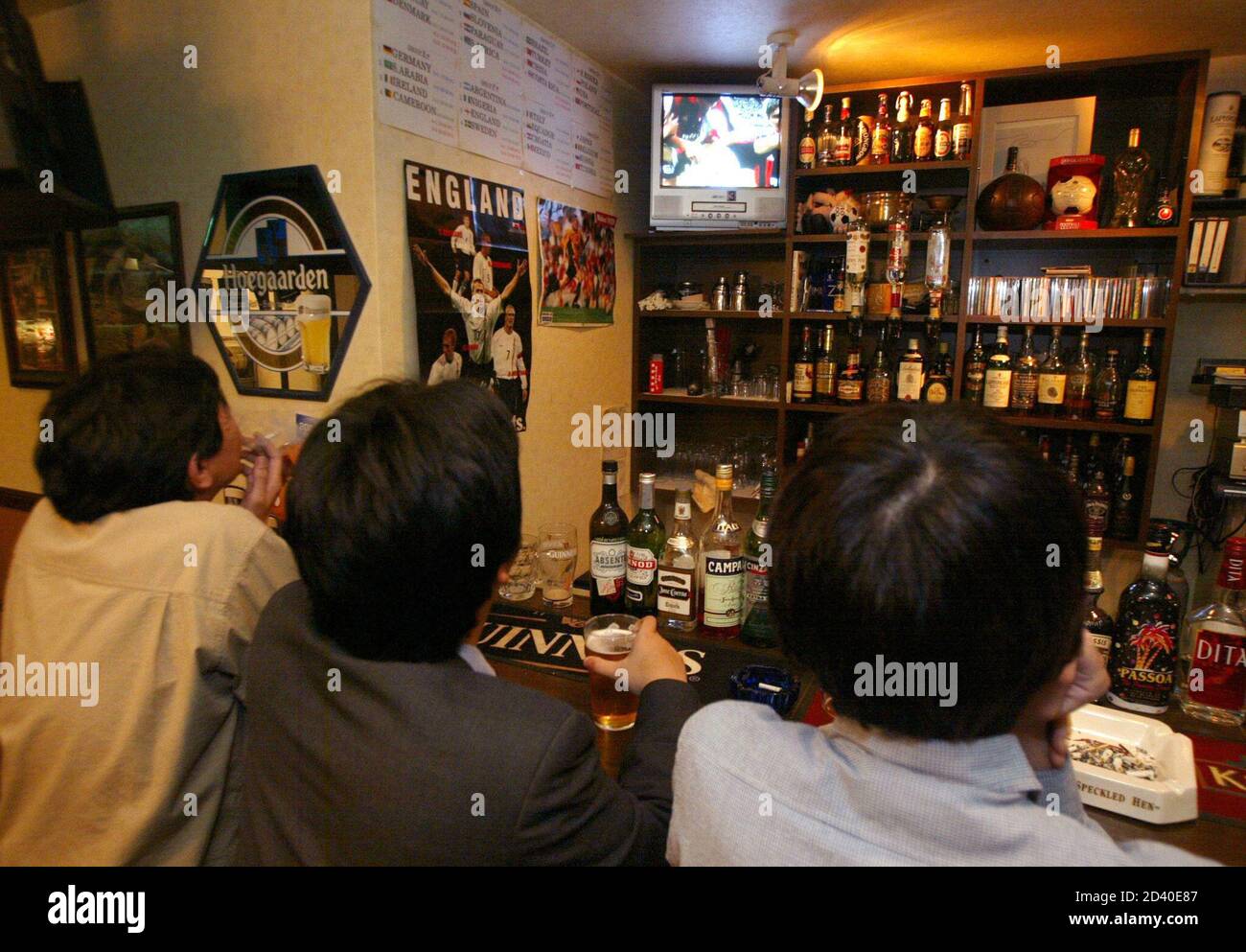 Soccer Fans Watch A Video Of The European Champions Cup Final In The Footnik A Bar For Football Fans Many Of Them Non Japanese In Tokyo May 16 02 Japanese Soccer Aficionados Are