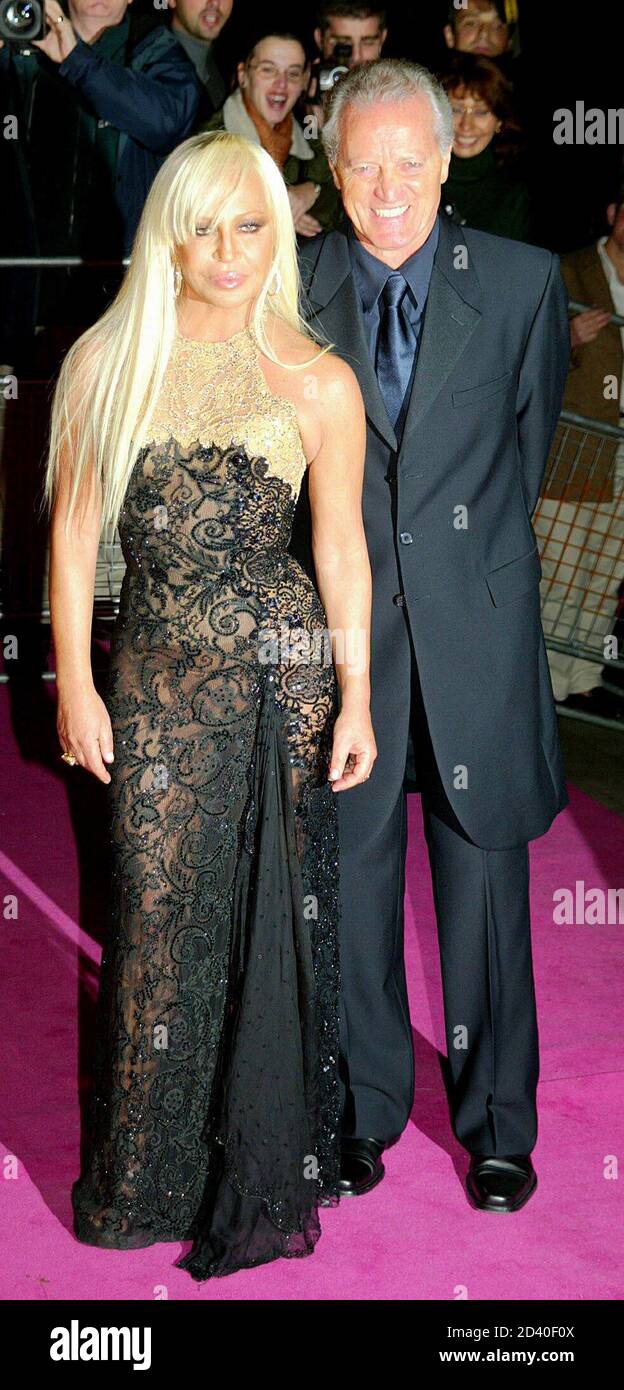 Italy's Donatella and Santo Versace arrive for the launch of the Gianni  Versace Exhibition at the Victoria and Albert Museum in London, October 14,  2002. [A major retrospective of work by fashion