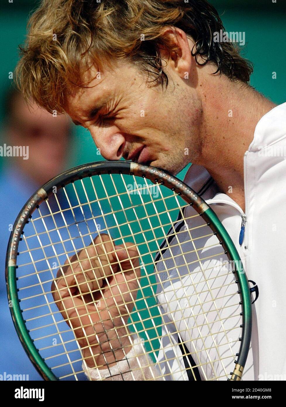 Juan Carlos Ferrero of Spain reacts during the last game of the French Open  tennis tournament final against Martin Verkerk of the Netherlands at Roland  Garros stadium in Paris, June 8, 2003.