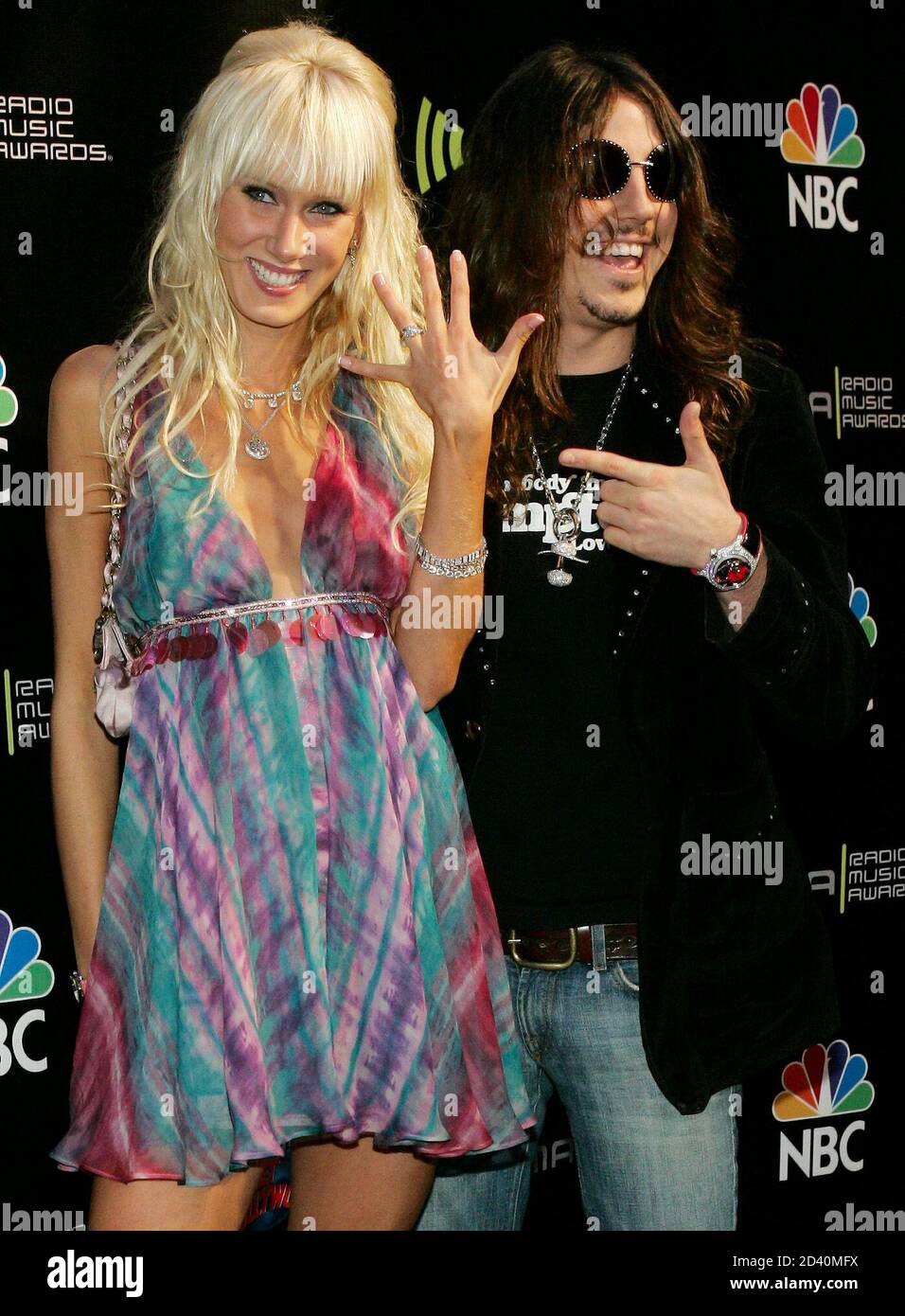 Kimberly Stewart, [daughter of musician Rod Stewart], and her fiance Cisco Adler show off Stewart's new ring as they arrive at the Radio Music Awards at the Aladdin Theatre for the Performing Arts in Las Vegas, Nevada October 25, 2004. Stock Photo