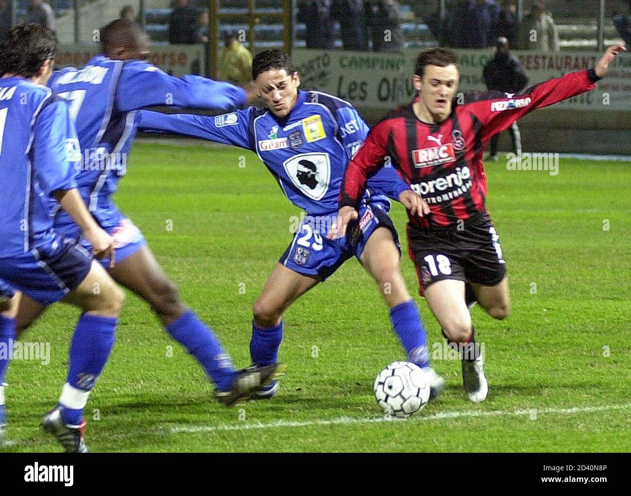 OGC Nice's Sebastien Roudet (R) challenges Chaouki Ben Saada (C) of Bastia  in their French soccer