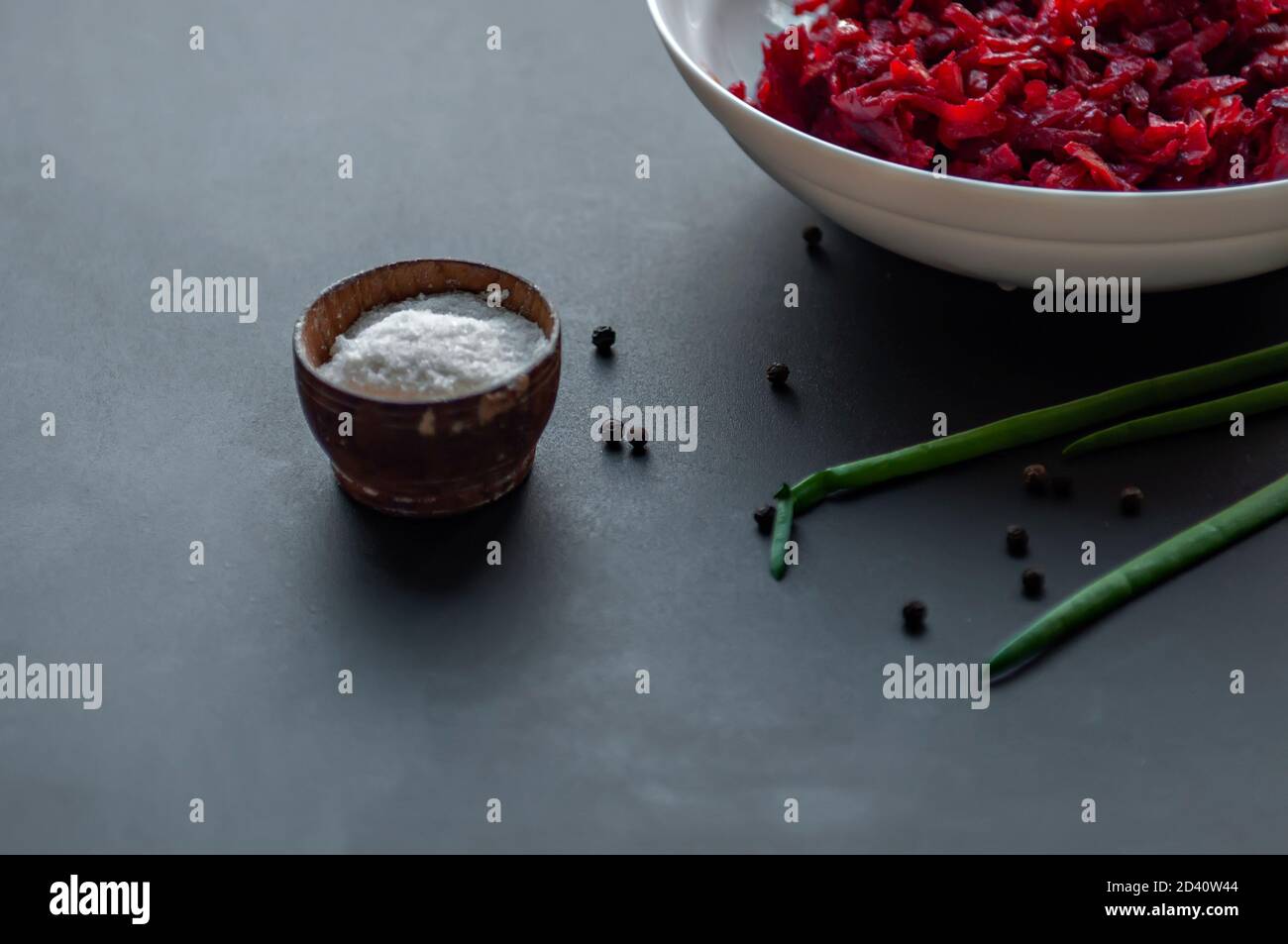 Cooking spices sea salt in a wooden container black pea pepper on the