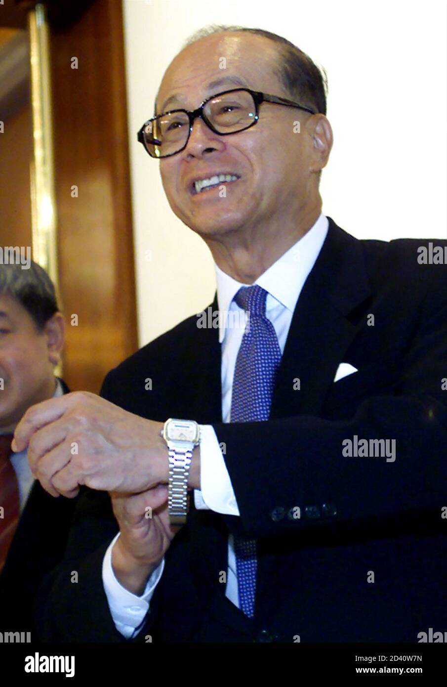 Hong Kong Property Tycoon Li Ka Shing Fixes His Watch After The Annual General Meeting Of Cheung Kong Holdings And Hutchison In Hong Kong May 24 2001 Hutchison Whampoa Ltd Group Managing Director