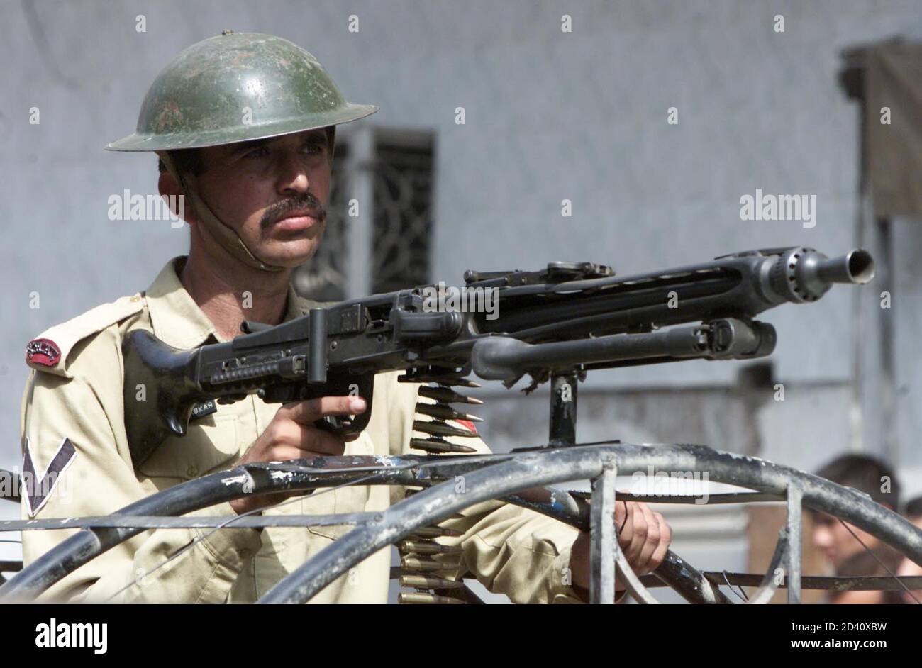 A Pakistani Soldier Watches A Rally In Peshawar October 9 2001 Pakistani Authorities Have Heightened Security Around The Country After A Series Of Violent Rallies Condemning The U S Led Attack On Afghanistan Reuters Zainal