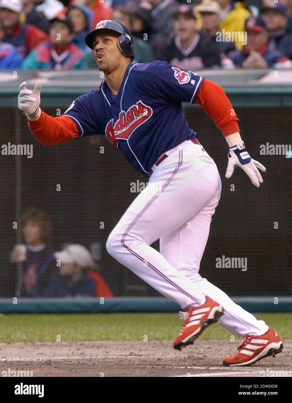 Cleveland Indians Juan Gonzalez watches his solo home run off Seattle  Mariners pitcher Freddy Garcia in the second inning of Game 4 of their  American League Divisional Series in Cleveland, October 14,