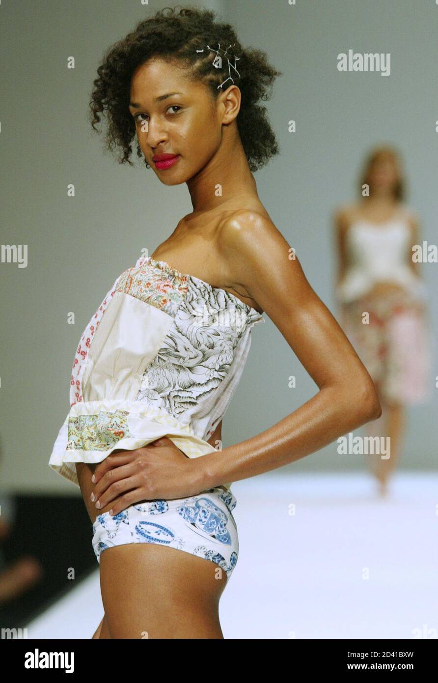 A model wears a garment by Canberra designer label Sandra Thom during Australian Fashion Week in Sydney May 9, 2002. Fashion week, which runs from May 6-10, showcases over 70 Australian and international designers. REUTERS/Mark Baker  DG/DL Stock Photo