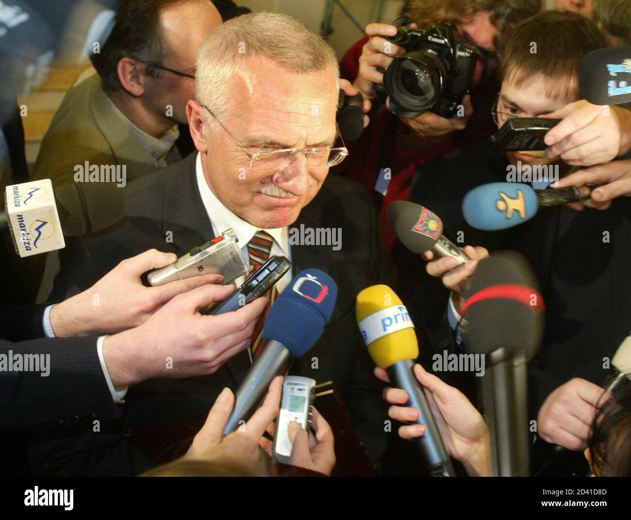 Former right-wing Czech Prime Minister Vaclav Klaus speaks to journalists after the first vote of the parlimentary session in the Spanish Hall at Prague Castle on January 24, 2003. Klaus won through to the second round on Friday in a presidential election to find a successor to Eastern Europe's elder statesman Vaclav Havel, a voting commission source said.  REUTERS/Petr Josek REUTERS Stock Photo