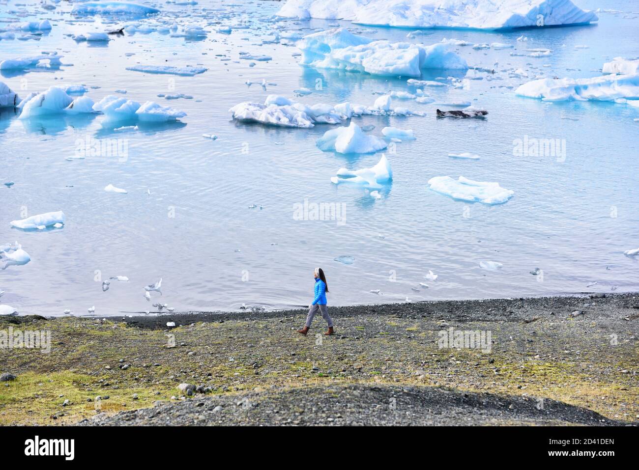 Iceland travel tourist enjoying view of nature landscape Jokulsarlon glacial lagoon / glacer lake on Iceland Stock Photo