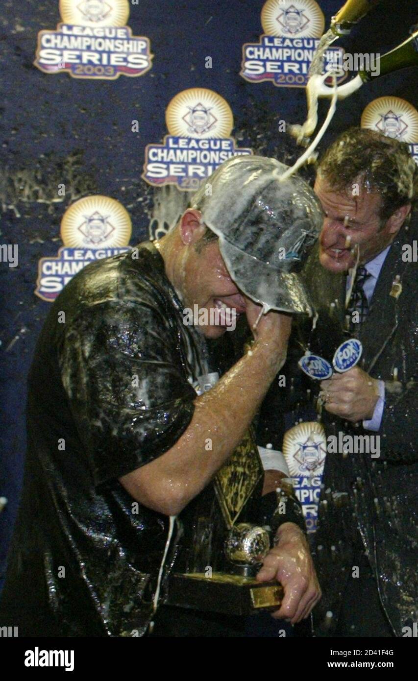 Florida Marlins Ivan Rodriguez celebrates his team 9-6 win over the Chicago  Cubs in Game 7 of their NLCS Championship series at Wrigley Field in  Chicago, October 15, 2003. Rodriguez was named