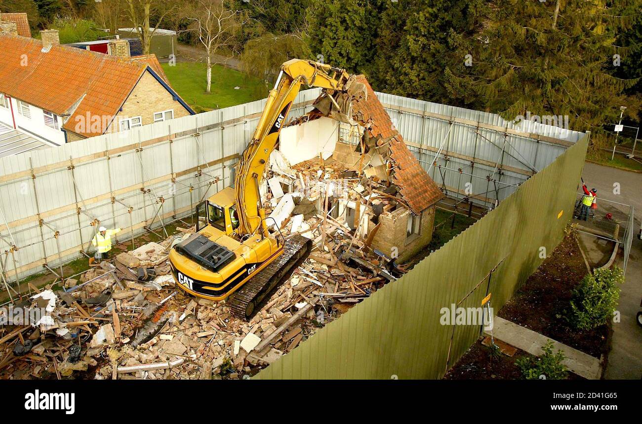 The house where British murderer Ian Huntley killed 10-year-old Soham school girls Holly Wells and Jessica Chapman is demolished in Soham, Cambridgeshire, eastern England, April 3, 2004. Cambridgeshire council condemned the property fearing it would be a permanent reminder of the grisly deaths, which have haunted the local community. Huntley murdered the girls in August 2002 after luring them into the house that came with his job as caretaker at Soham Village College, which was on the same site as their primary school. REUTERS/Peter Macdiarmid  PKM/JD Stock Photo