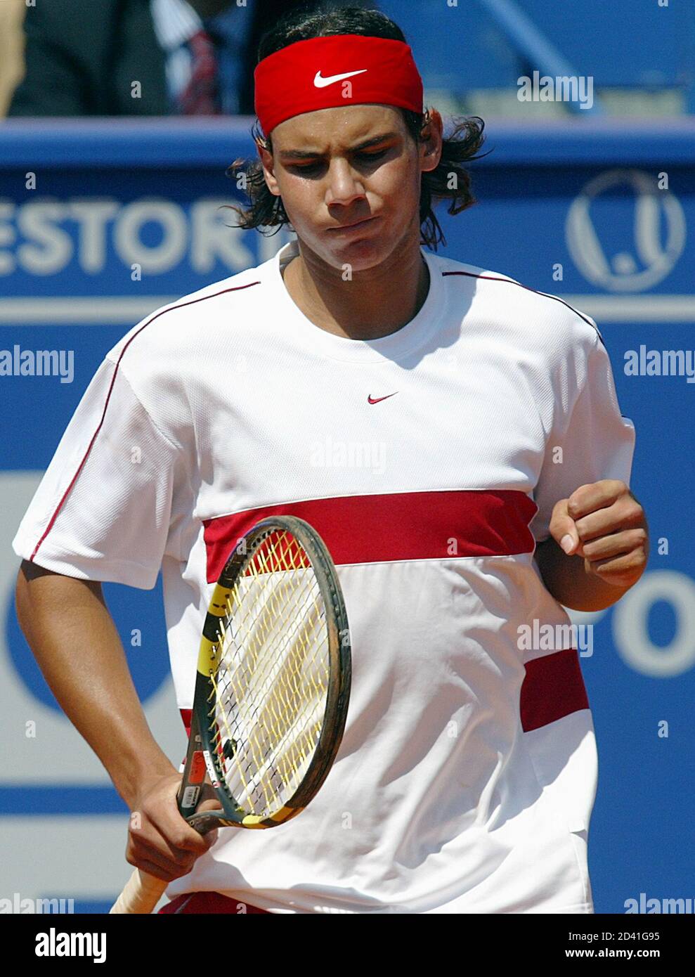 Spanish tennis player Rafael Nadal enjoys a point scored against Croatian  Goran Ivanisevic during the Estoril Open first round in Jamor surroundings  of Lisbon April 14, 2004. Rafael Nadal won by 6-4