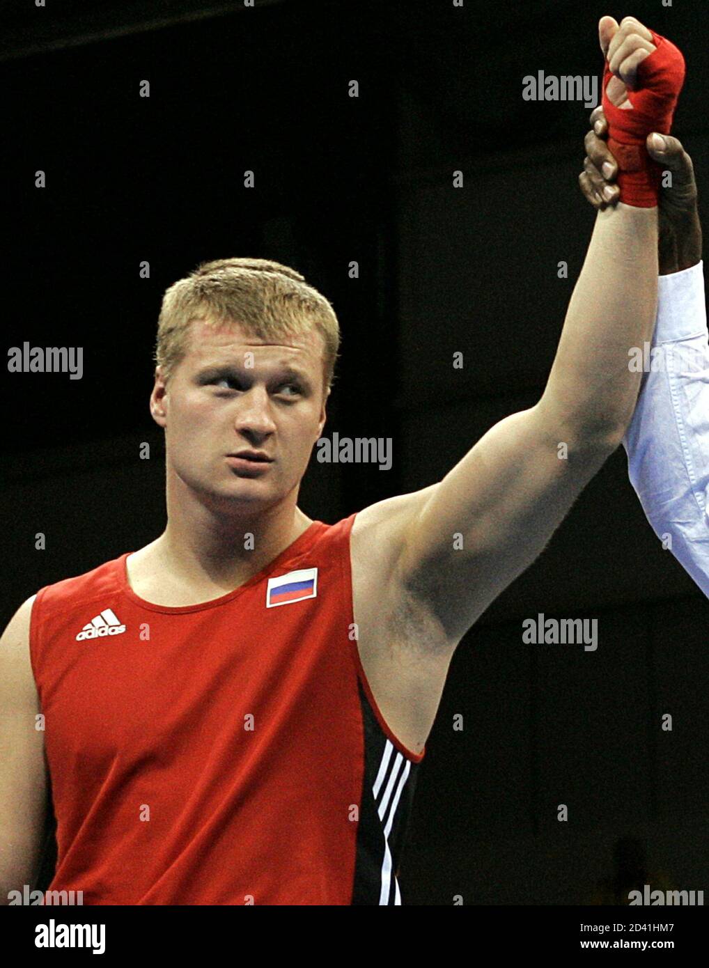 Russia's Alexander Povetkin celebrates victory in the men's boxing super heavyweight ( kg) final at the Athens 2004 Olympic Summer Games, August 29, 2004. Povetkin won his gold medal with a walkover. Stock Photo